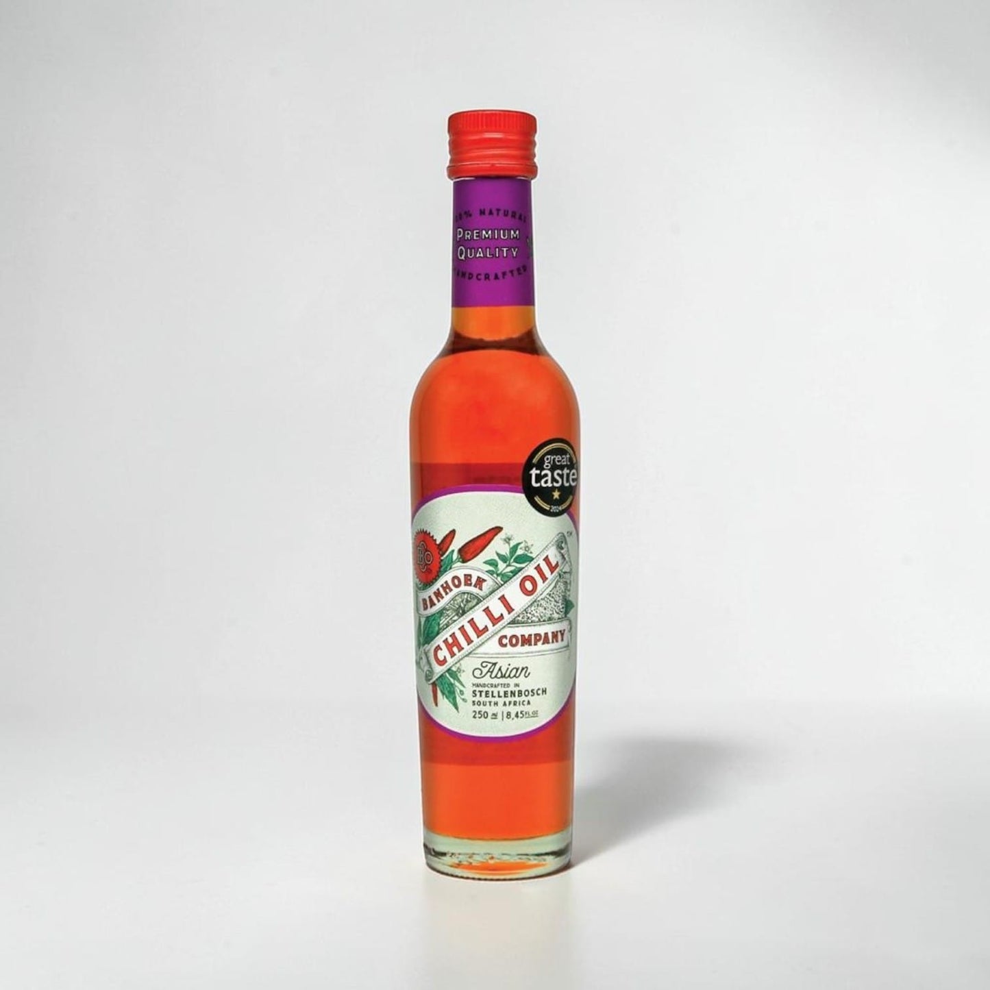 Saporia | Artisan UK Vegan Cheesemonger & Deli Banhoek Asian chilli oil in a 250ml glass bottle with red cap.
