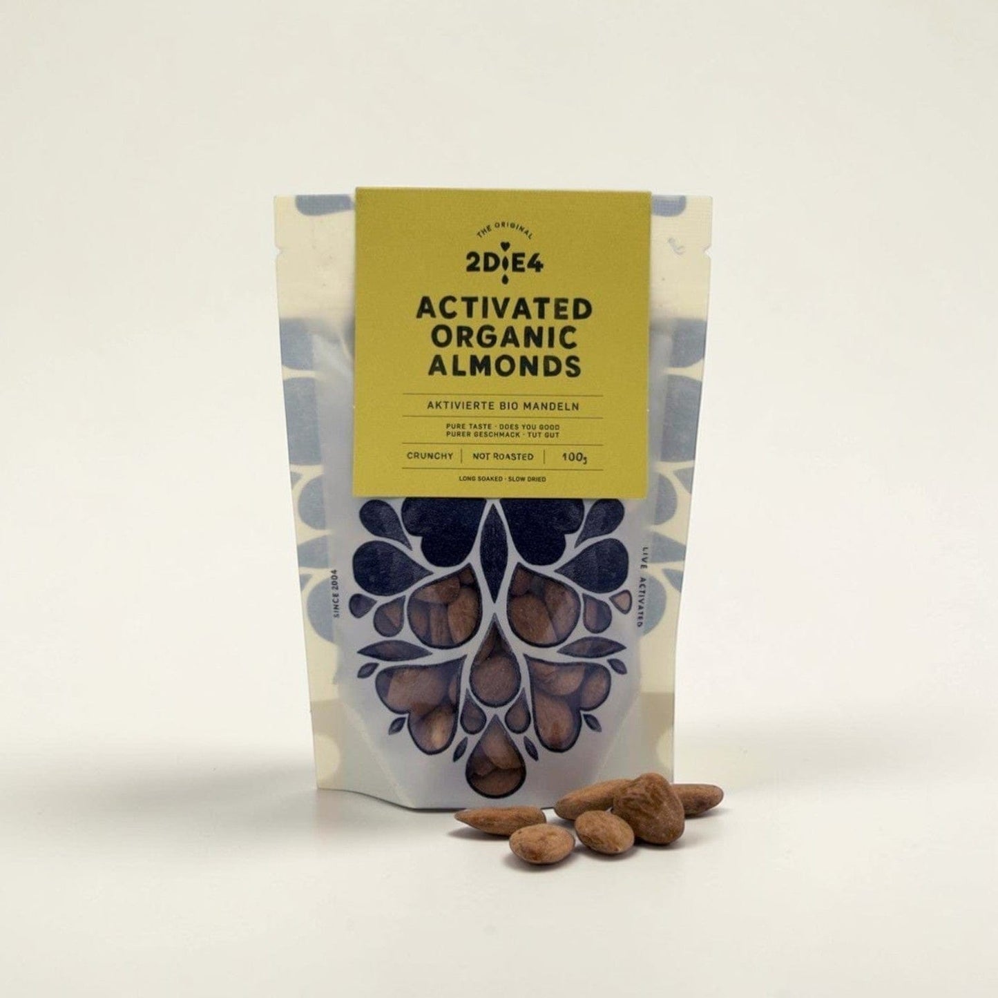 Saporia Activated Organic Almonds 100g bag, crunchy, not roasted, slow-dried, vegan snack.