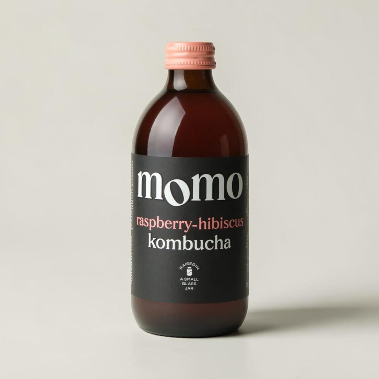 Saporia | Artisan UK Vegan Cheesemonger & Deli Momo organic raspberry-hibiscus kombucha in a glass bottle with pink cap