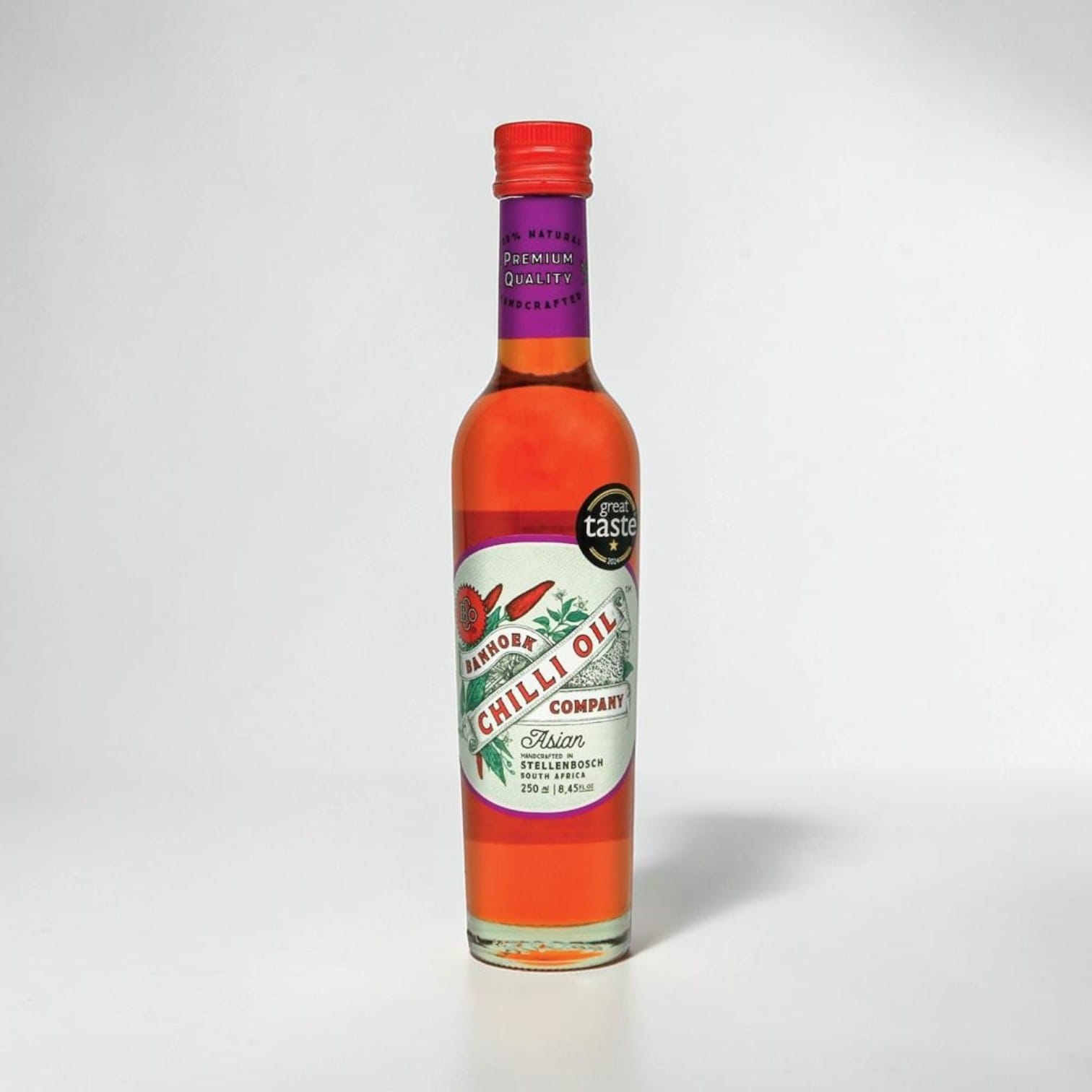 Saporia | Artisan UK Vegan Cheesemonger & Deli Banhoek Asian chilli oil in a 250ml glass bottle with red cap.