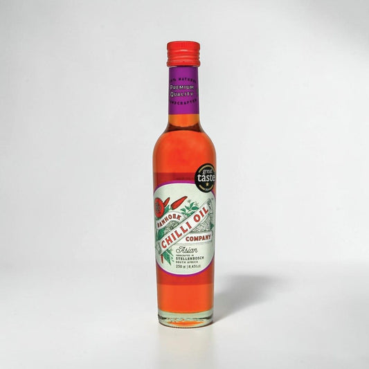 Saporia | Artisan UK Vegan Cheesemonger & Deli Banhoek Asian chilli oil in a 250ml glass bottle with red cap.