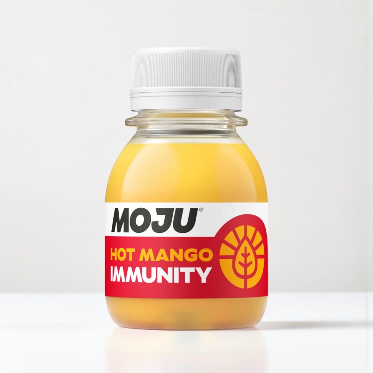 Saporia | Artisan UK Vegan Cheesemonger & Deli Hot Mango Immunity Shot with mango, orange, lemon, ginger, turmeric, and cayenne.