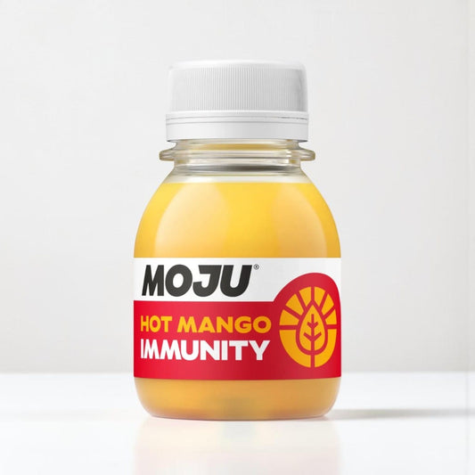 Saporia | Artisan UK Vegan Cheesemonger & Deli Hot Mango Immunity Shot with mango, orange, lemon, ginger, turmeric, and cayenne.