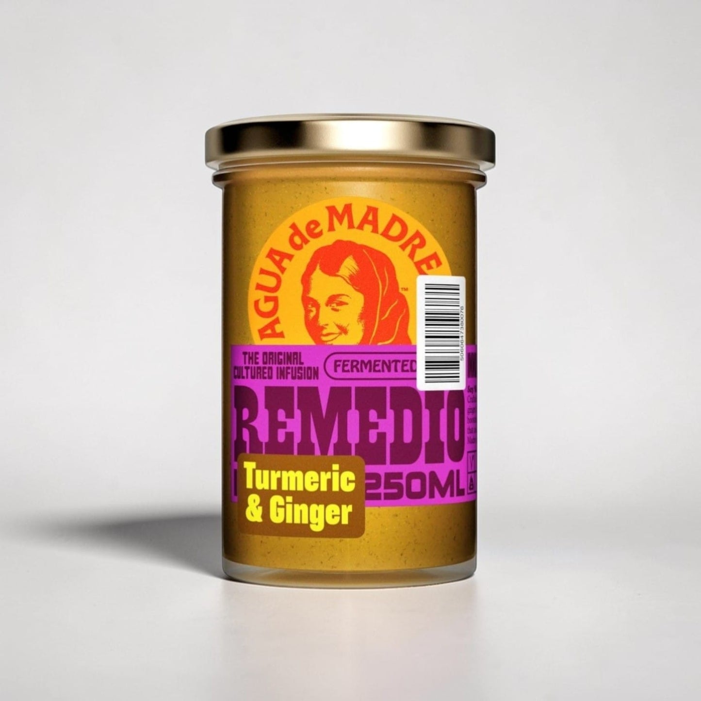 Saporia Remedio Turmeric & Ginger Cultured Infusion in a glass jar with a gold lid. Golden yellow liquid with purple and yellow label.