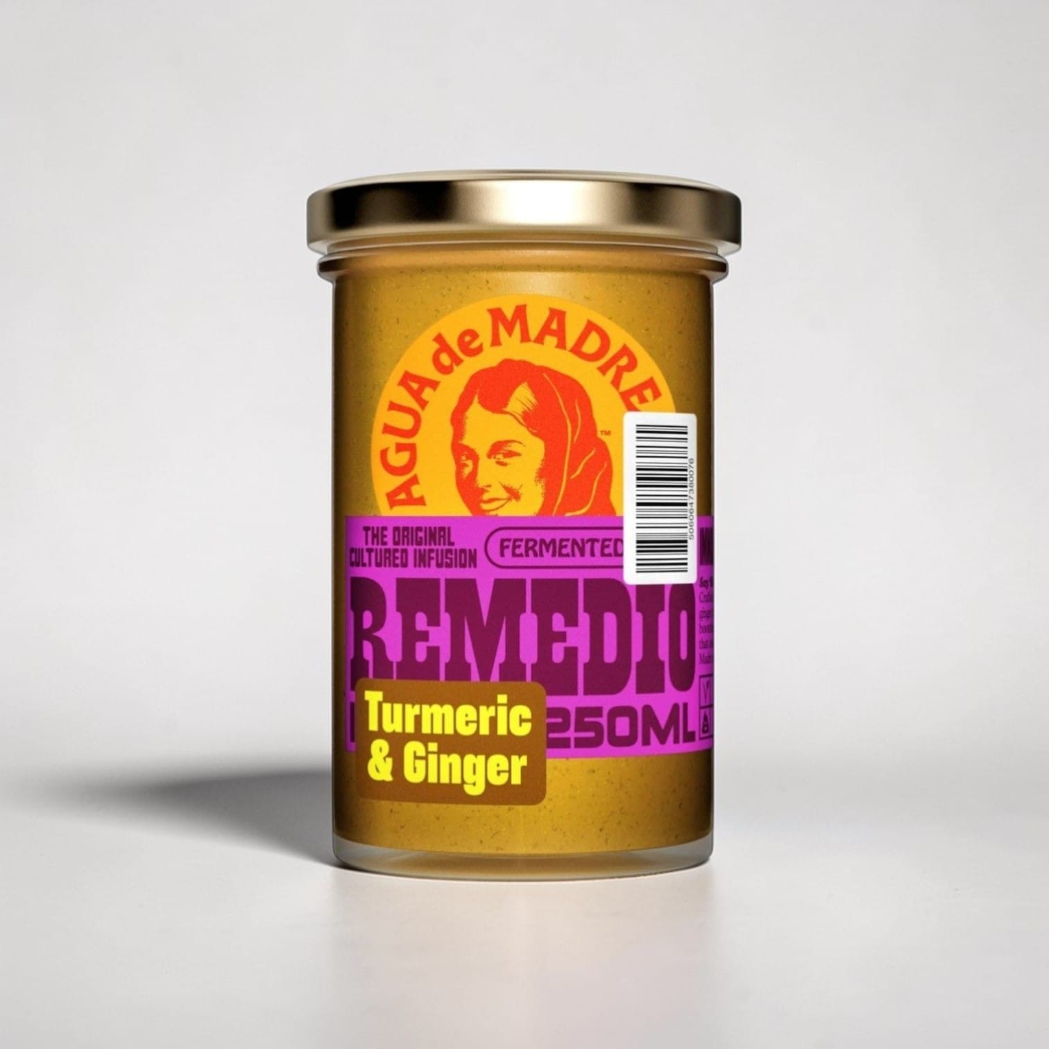 Saporia Remedio Turmeric & Ginger Cultured Infusion in a glass jar with a gold lid. Golden yellow liquid with purple and yellow label.